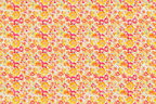 Vibrant floral pattern with yellow, orange, and pink blossoms on a light background.