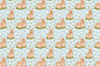 Vintage watercolor bunny and floral pattern featuring brown rabbits and white flowers on a light blue background.