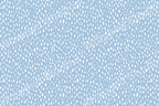 White raindrop shapes on a periwinkle blue backdrop create a modern abstract pattern.
