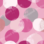 Abstract geometric pattern with overlapping distressed circles in shades of pink and gray.