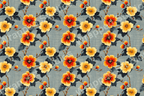 Seamless floral pattern with orange and yellow hibiscus flowers and dark blue leaves on a blue textured background.