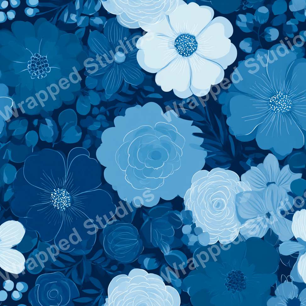 Elegant floral pattern with dark and light blue flower blossoms and foliage.
