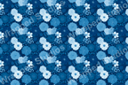 Monochromatic blue floral pattern featuring roses, daisies, and foliage in varying shades.