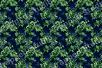 Vintage green floral pattern with moody botanical motifs on a dark navy blue background.