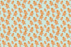 Cute gingerbread man pattern with smiling Christmas cookies scattered on a light mint green background.