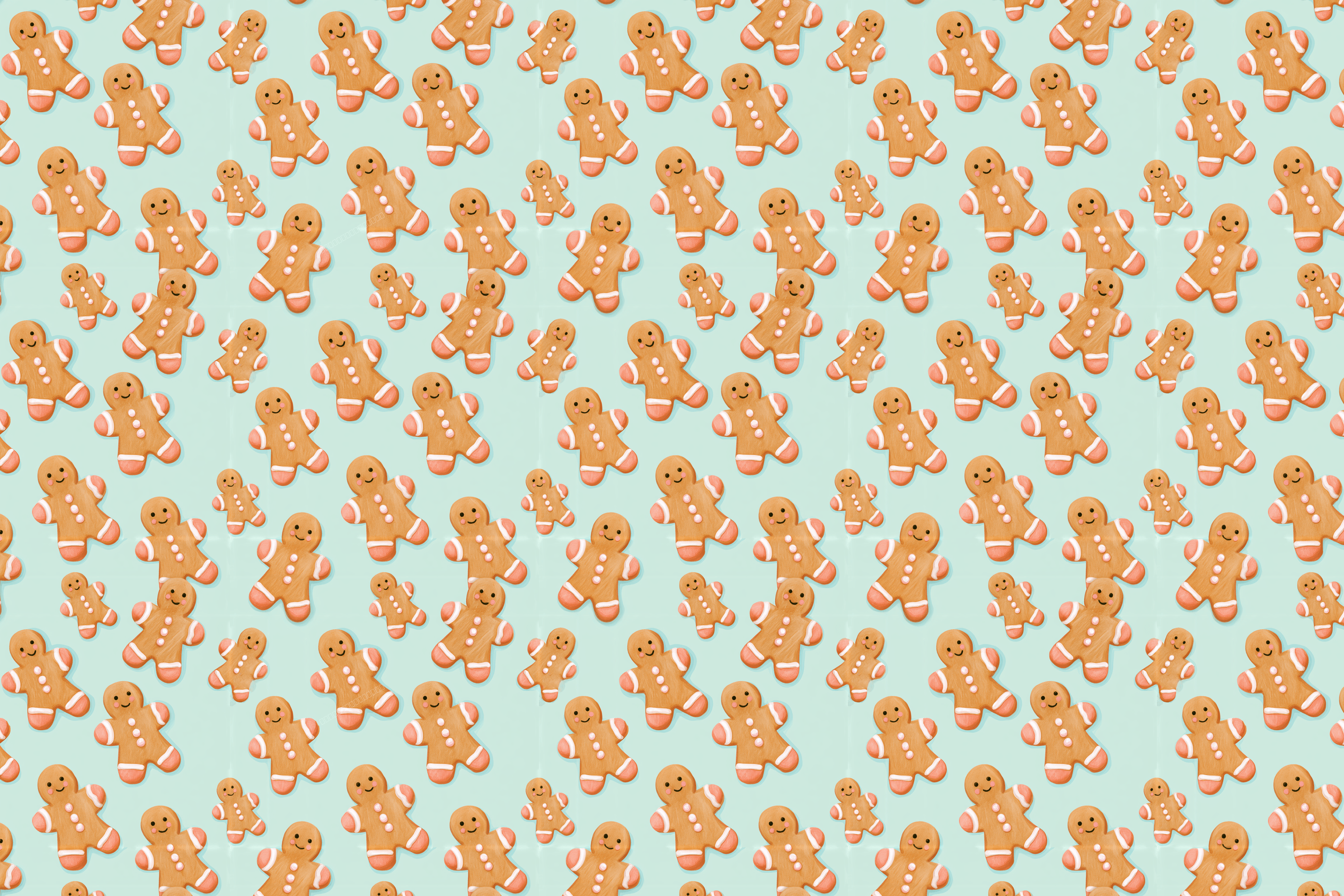 Cute gingerbread man pattern with smiling Christmas cookies scattered on a light mint green background.