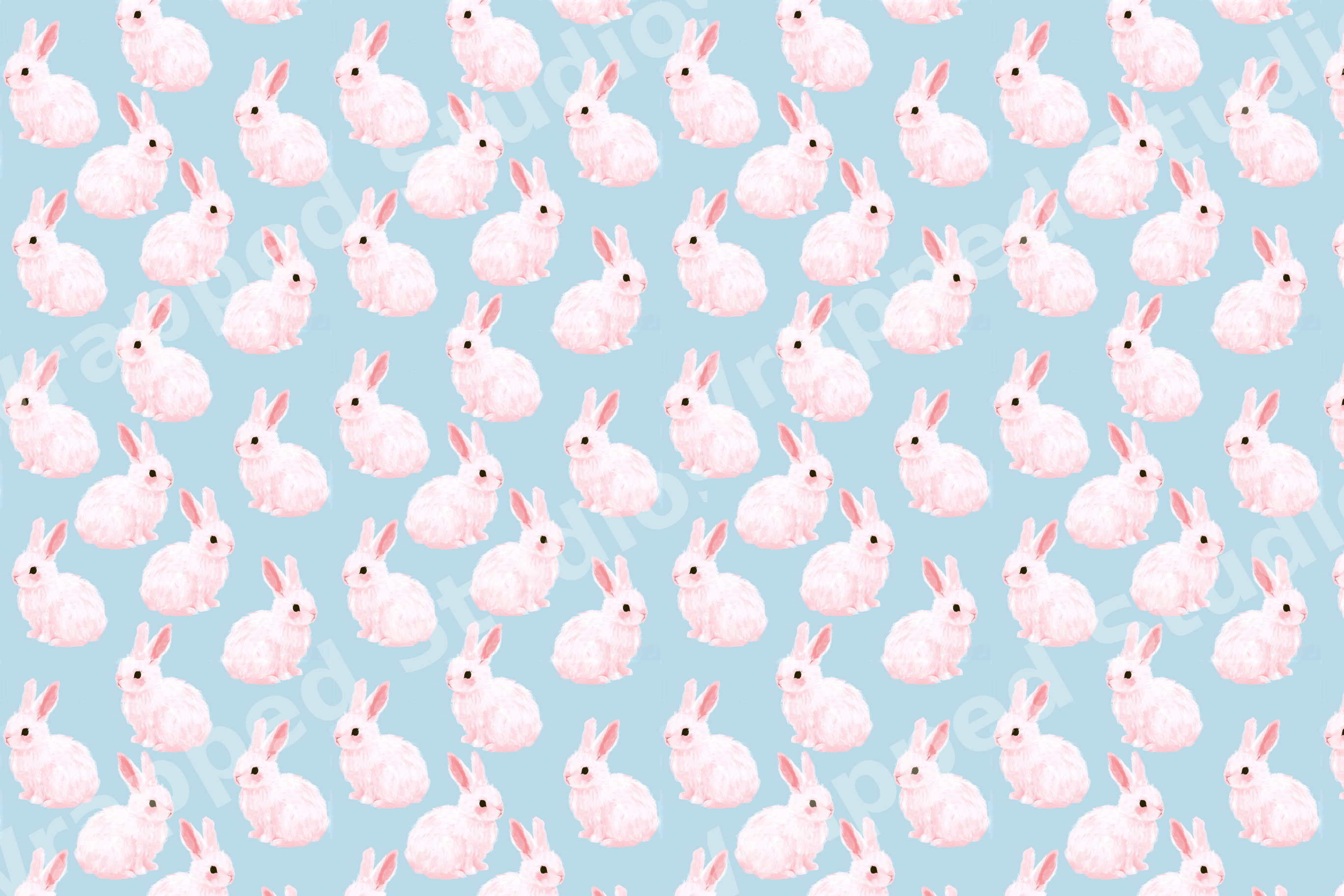 Cute watercolor bunny pattern featuring soft pink rabbits on a pastel blue background.