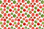 A playful pattern of watercolor Christmas ornaments in festive red, green, and orange with various textures.