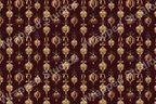 Ornate gold Christmas ornament pattern with ribbons and holly on a burgundy background.
