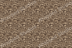 Intricate floral pattern with swirling leaves in shades of brown and tan.