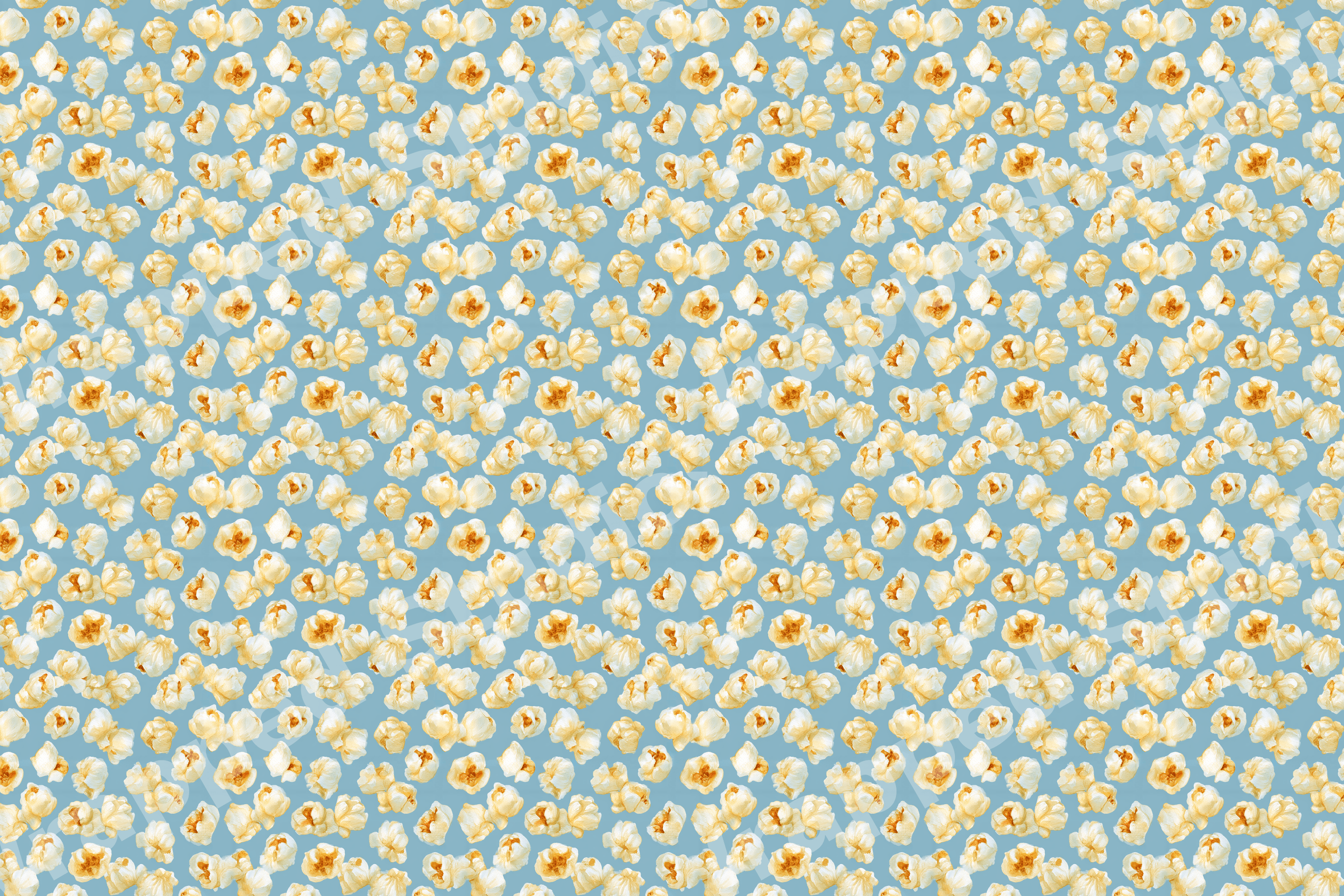 Playful watercolor popcorn pattern featuring scattered yellow kernels on a dusty blue background.