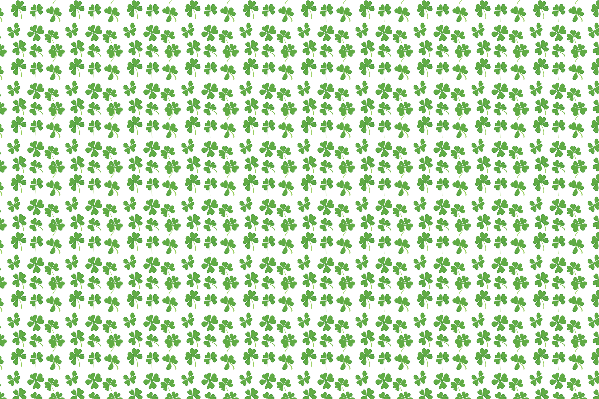 Pattern of green clover leaves on a white background. Wrapped Studios luxury wrapping paper.