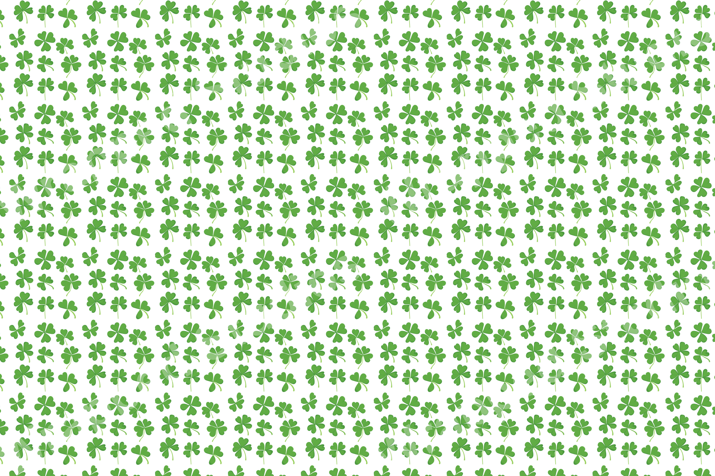 Delicate green clover botanical pattern on a white background.