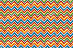 Colorful chevron pattern with red, yellow, green, and blue waves against a white background.