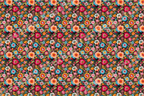 Vibrant folk art floral pattern with colorful pink, blue, and orange blossoms on a black background.