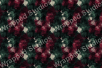 Abstract painterly pattern with brushstroke textures in deep red, forest green, and cream colors.