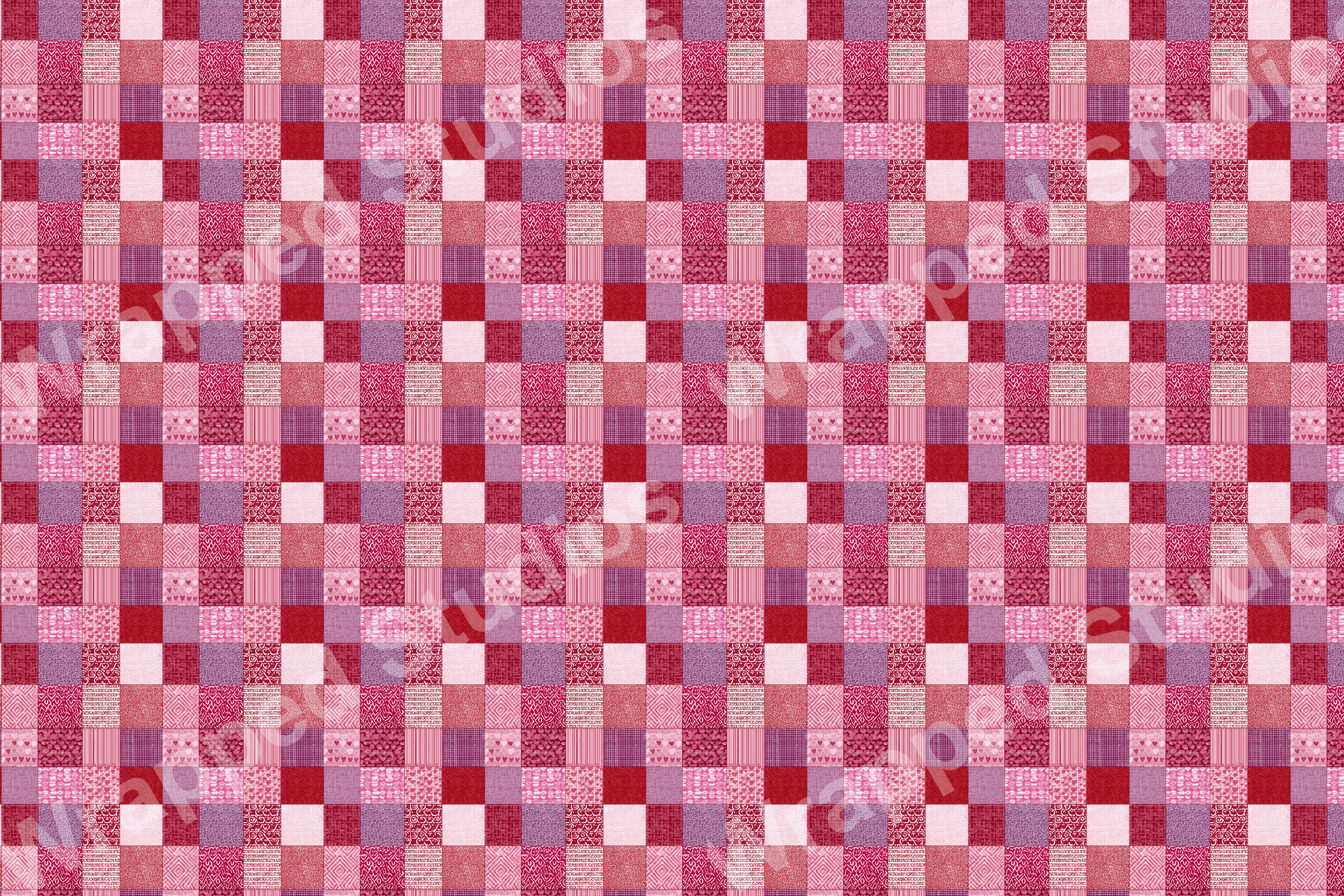 A patchwork geometric pattern with textured squares in shades of pink, red, and purple for a cozy, rustic aesthetic.