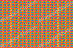 Dense rainbow geometric pattern in red, orange, yellow, green, light blue and dark blue with white border.