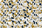 Modern abstract print with gold, navy, and white geometric terrazzo-style shards in a seamless pattern.