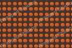 Repeating jack-o'-lantern pattern in orange on a dark brown background.