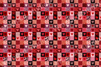 Romantic patchwork heart pattern in various shades of red, pink, and black, featuring diverse textures and playful elements.