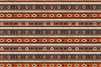 Rustic Southwestern geometric pattern featuring terracotta, blue, and cream tribal stripes.