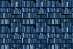 Seamless vintage bookshelf pattern with antique library books in monochromatic navy blue.