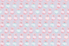 Pastel watercolor Christmas ornament pattern featuring pink and teal baubles on a light purple background.