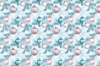 Blue and pink Christmas ornaments with pine needles form a festive holiday pattern.