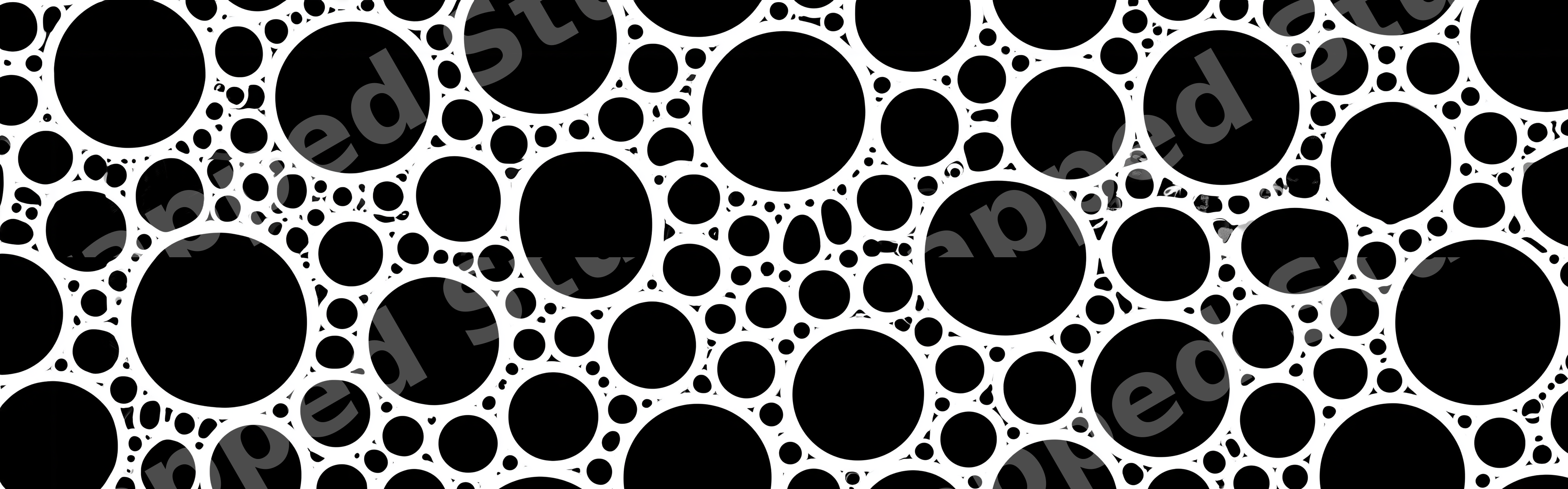 Modern black and white geometric pattern of varying circles in an abstract bubble print.