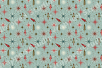 Retro mid-century atomic pattern with red rockets and starbursts on a sage green background.