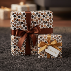 Modern polka dot wrapping paper in browns and creams with chocolate and gold ribbons, perfect for luxury birthday or holiday gifts.