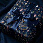 Elegant gift wrapped in navy beetle-print wrapping paper with satin ribbon and bow.
