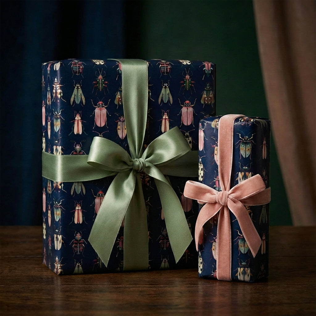 Stylish gifts wrapped in beetle-print paper with satin and velvet ribbons, luxury gift wrap.