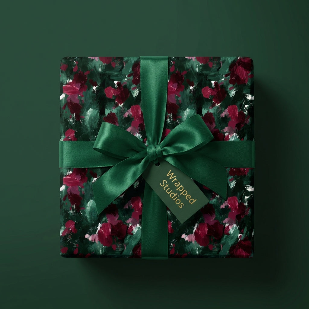 Elegant floral wrapping paper with dark green ribbon and Wrapped Studios gift tag.