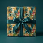 Gift box wrapped in artsy abstract wrapping paper with a teal satin ribbon.