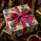 Luxurious present with abstract floral wrapping paper and velvet ribbon. Wrapped Studios.