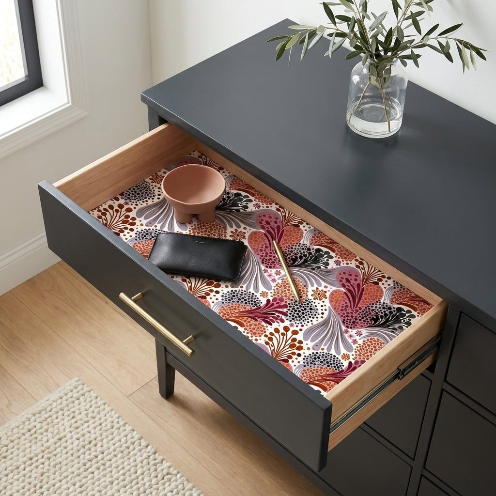 Modern floral wrapping paper in terracotta and mauve used as a drawer liner by Wrapped Studios.