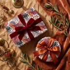Luxury autumn floral wrapping paper with velvet and satin bows on gift boxes by Wrapped Studios.