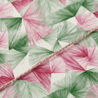 Modern geometric wrapping paper with a festive pink and green abstract fan pattern and a delicate gold string accent.