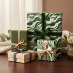 Gifts wrapped in elegant green wave wrapping paper with velvet ribbon bows.