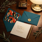 Elegant teal wedding invitation suite with music themed envelope liners by Wrapped Studios.