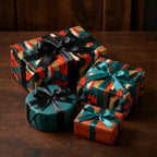 Vintage music wrapping paper and teal gift wrap with satin bows by Wrapped Studios.