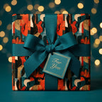 Retro guitar wrapping paper with a teal ribbon and gift tag by Wrapped Studios, perfect for music lovers.
