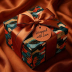 Luxury guitar wrapping paper in teal and copper with a satin bow, from Wrapped Studios.