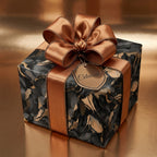 Elegant gift wrapped in black and gold modern wrapping paper, with a satin bow.