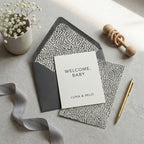Minimalist welcome baby card with modern black and white pattern and gray envelope by Wrapped Studios.