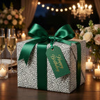 Luxury black and white patterned birthday wrapping paper with a green satin ribbon by Wrapped Studios.