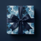 Luxury blue abstract brushstroke wrapping paper with a navy satin bow by Wrapped Studios.
