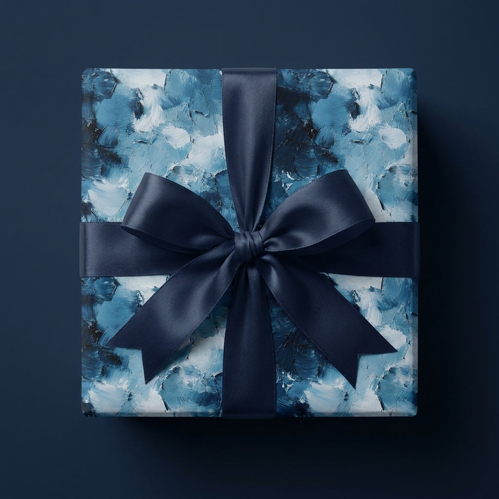 Luxury blue abstract brushstroke wrapping paper with a navy satin bow by Wrapped Studios.